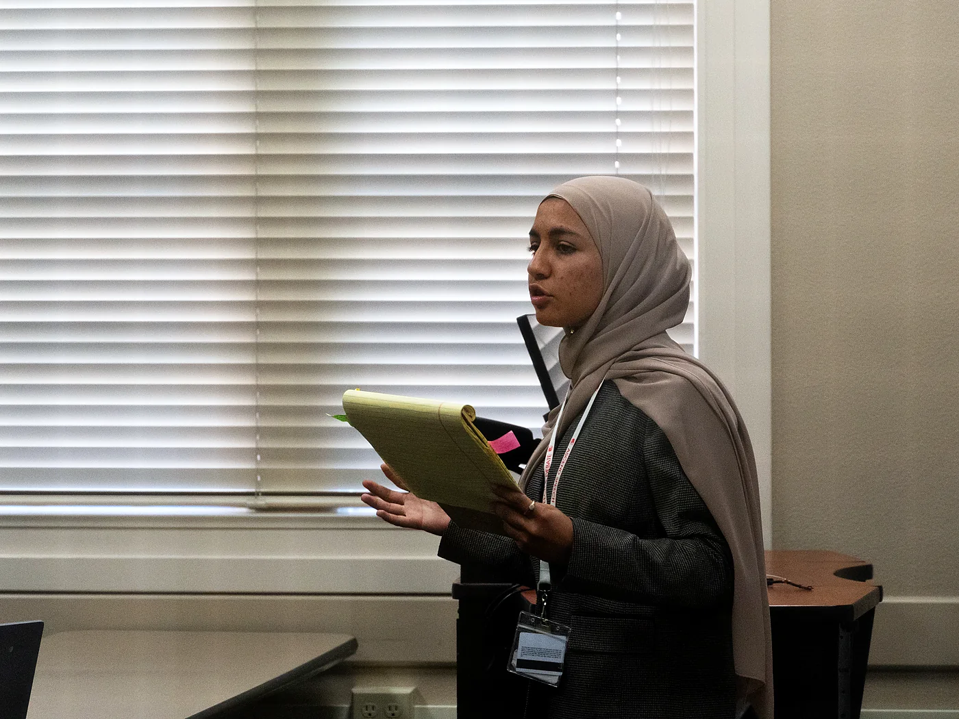 An Ascend student delivering a speech from prepared notes